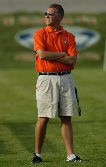 Coach Chris Bianchi standing on a field during his UW–Platteville years.